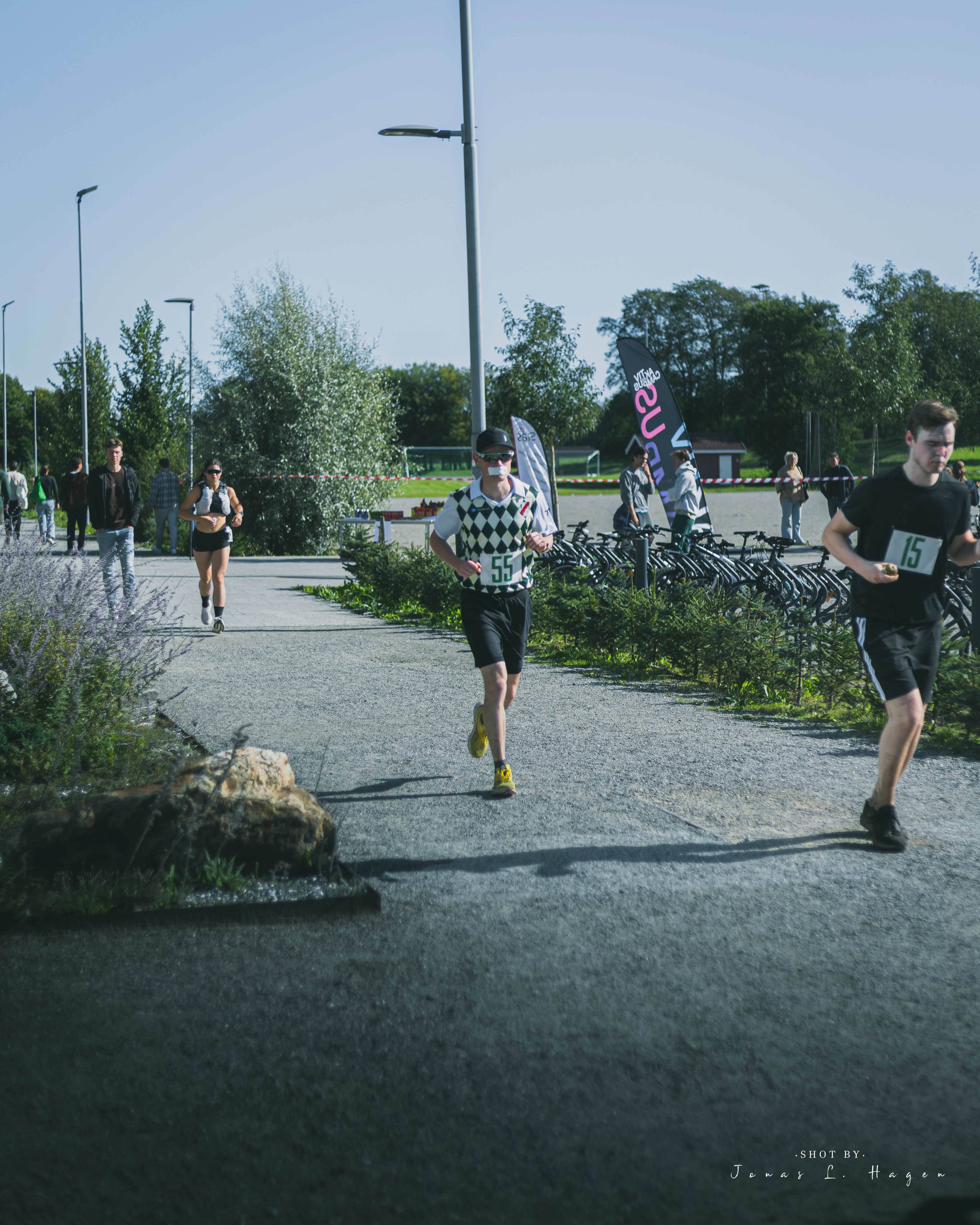 Runners with race numbers on the course